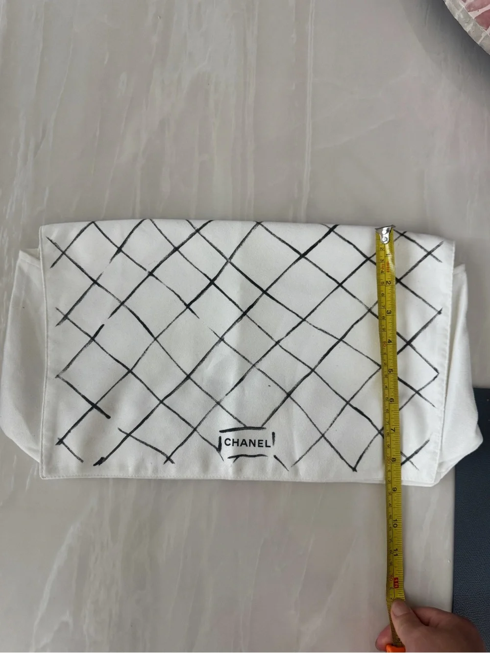 CHANEL White Dust Bag with Black Quilted Grid